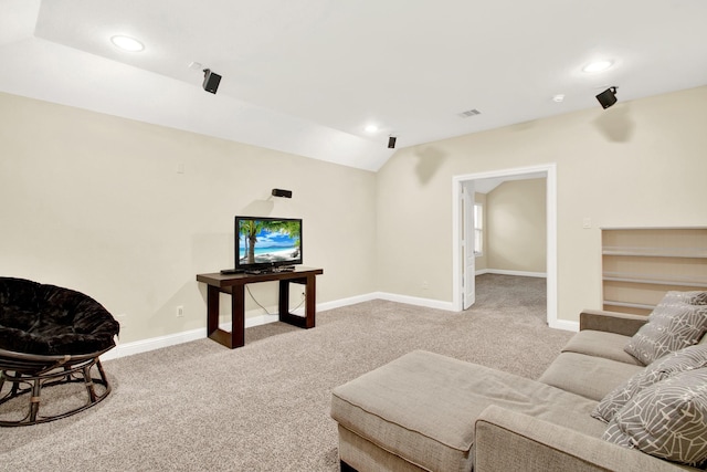 carpeted living room featuring lofted ceiling