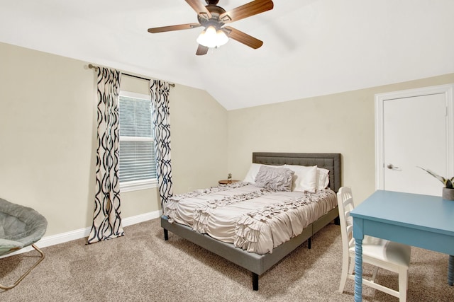 bedroom with ceiling fan, lofted ceiling, and carpet