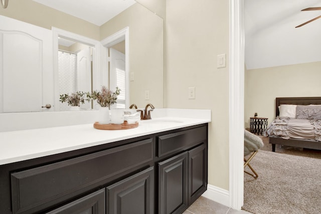 bathroom with ceiling fan, tile patterned floors, and vanity