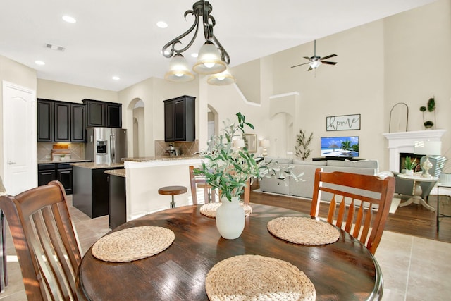 dining area featuring ceiling fan and light tile patterned floors