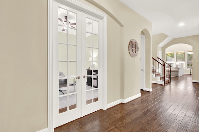 interior space with french doors, ceiling fan, and dark hardwood / wood-style floors