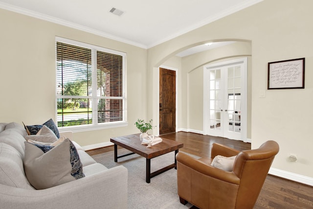 living room with ornamental molding and hardwood / wood-style floors