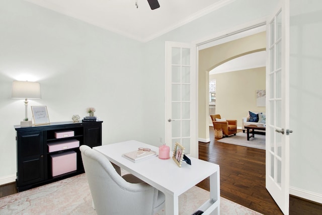 dining room with french doors, crown molding, and wood-type flooring