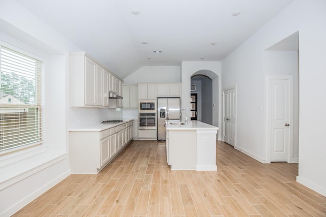 kitchen featuring white cabinets, appliances with stainless steel finishes, and a center island