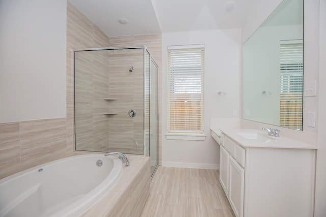 bathroom with vanity and plus walk in shower