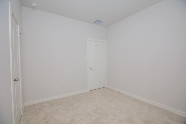 empty room with light colored carpet