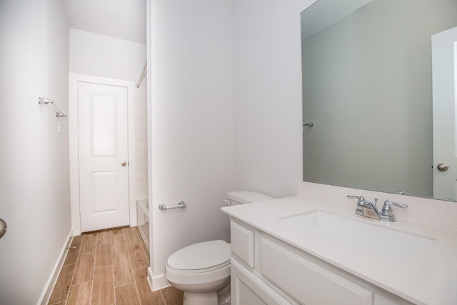 full bathroom with toilet, vanity, and  shower combination