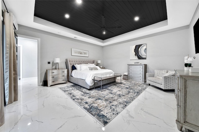 bedroom with wood ceiling and a tray ceiling