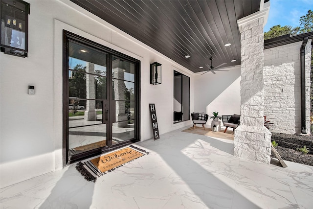 view of patio / terrace featuring ceiling fan