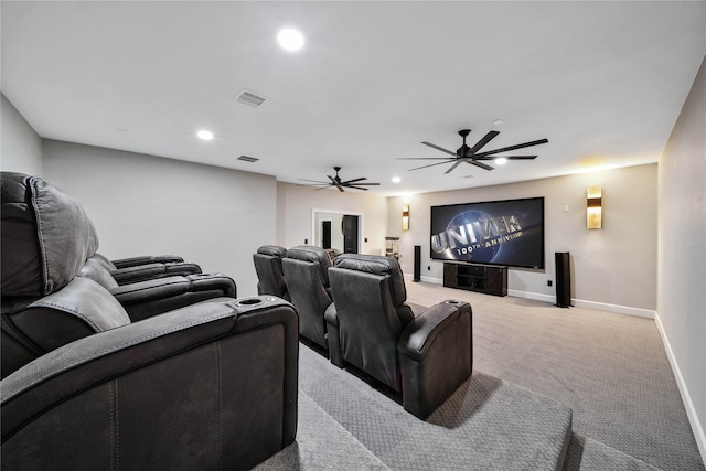 carpeted home theater featuring ceiling fan