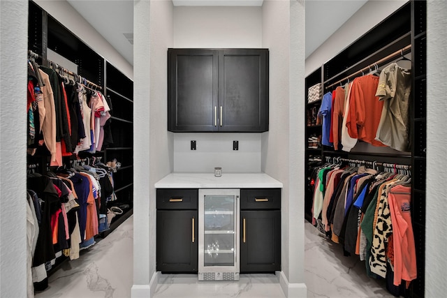 walk in closet featuring wine cooler