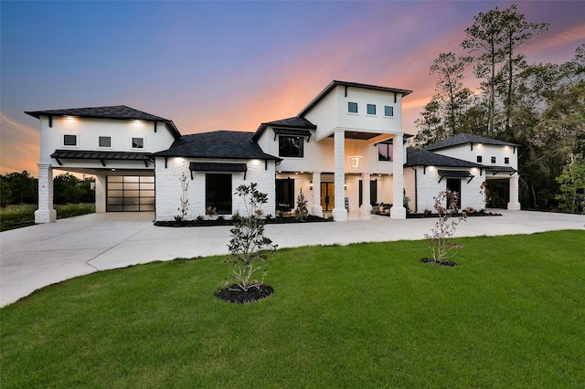 contemporary home with a lawn