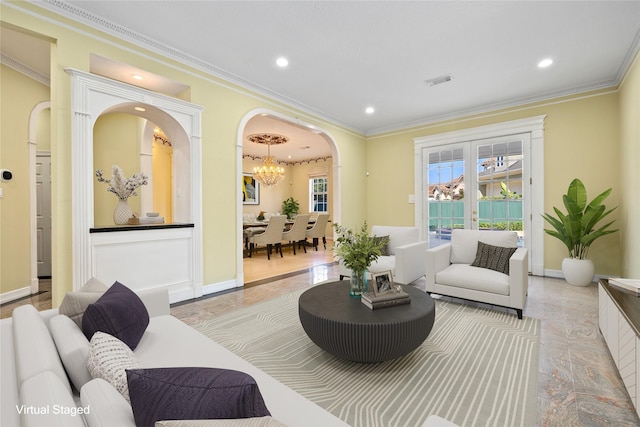 living room with arched walkways, recessed lighting, visible vents, baseboards, and ornamental molding