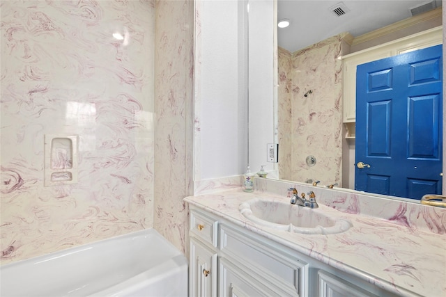 full bath with visible vents, vanity, and a bath