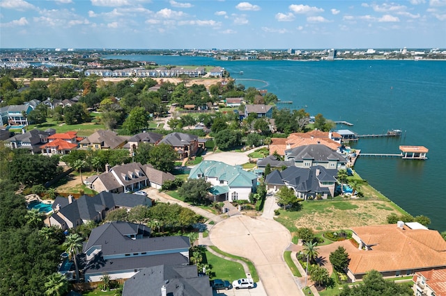 birds eye view of property featuring a water view and a residential view