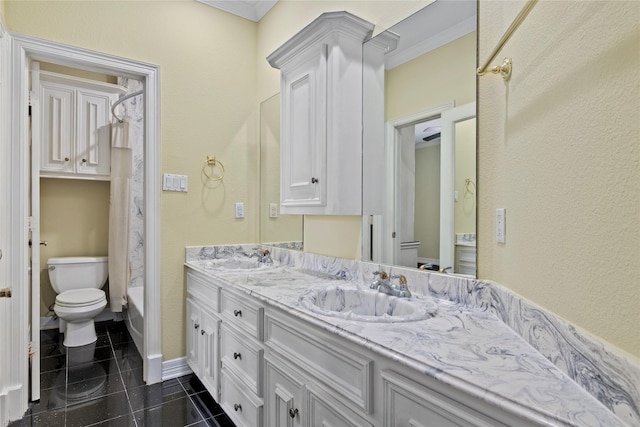 full bathroom with tile patterned flooring, a sink, toilet, and double vanity