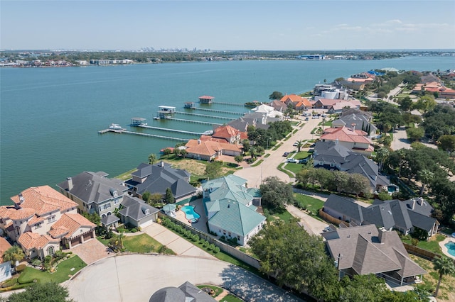 birds eye view of property featuring a water view and a residential view