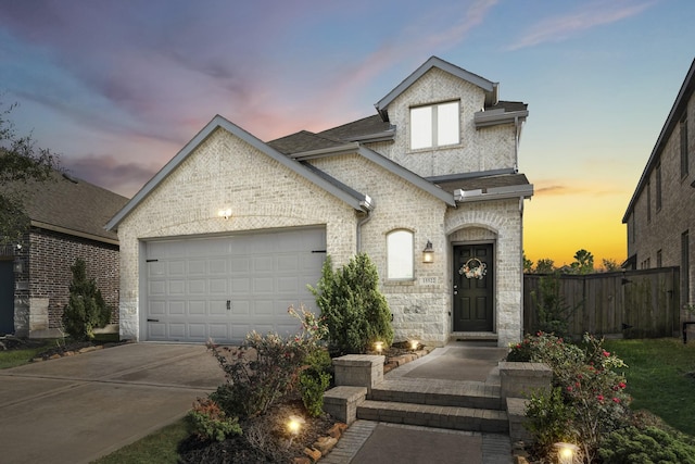 french country home with a garage