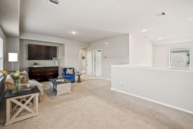 carpeted living room with a healthy amount of sunlight