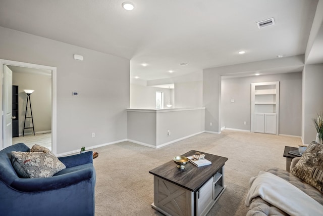 living room with light colored carpet