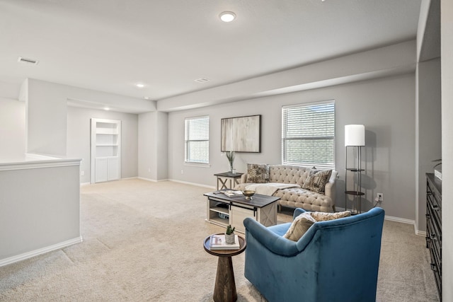 living room featuring light carpet