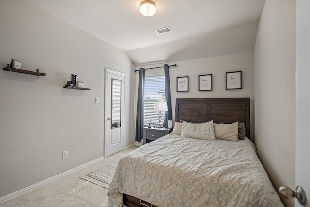 carpeted bedroom featuring lofted ceiling