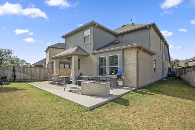 rear view of house with central air condition unit, a patio area, and a lawn