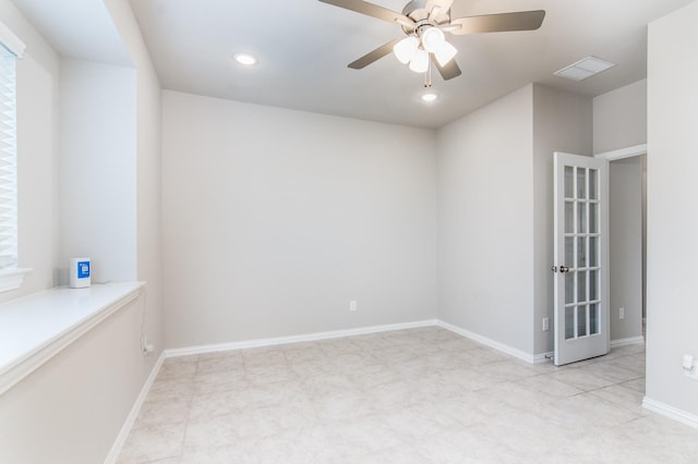 spare room with french doors and ceiling fan