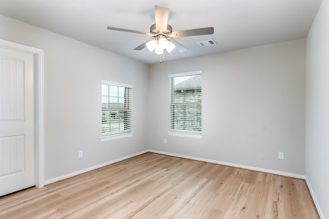 spare room with ceiling fan and light hardwood / wood-style floors