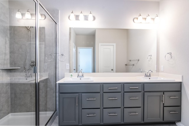 bathroom with an enclosed shower and vanity