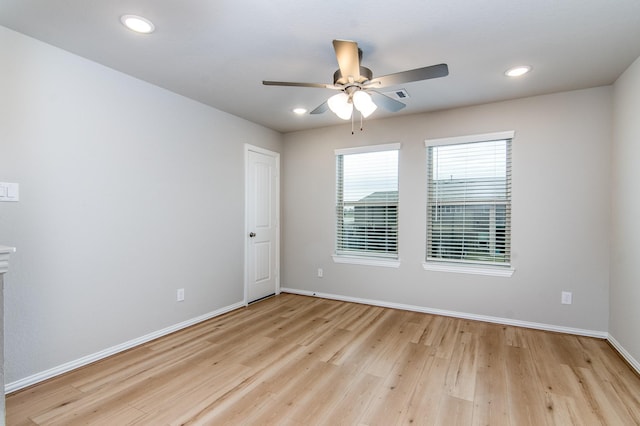 unfurnished room with a ceiling fan, recessed lighting, baseboards, and light wood finished floors