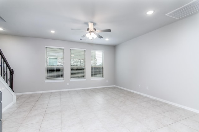 empty room with ceiling fan, visible vents, baseboards, and recessed lighting