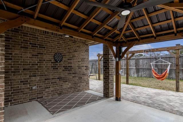 view of patio featuring a fenced backyard, ceiling fan, and a gazebo