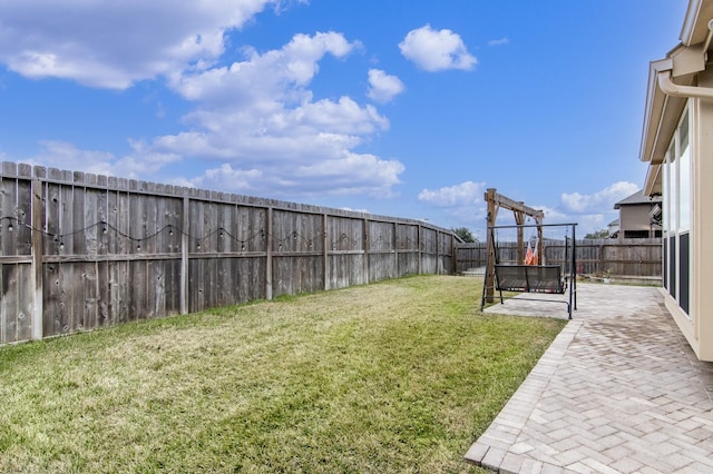 view of yard featuring a patio area and a fenced backyard