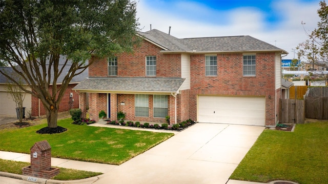 view of front of property with a front lawn and a garage