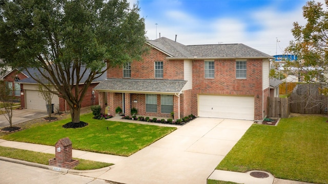 view of front of property with a front lawn and a garage