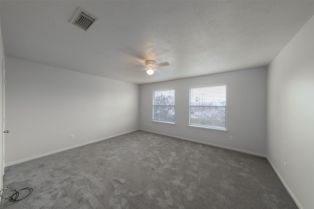 spare room with carpet flooring and ceiling fan