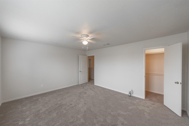 carpeted empty room with ceiling fan