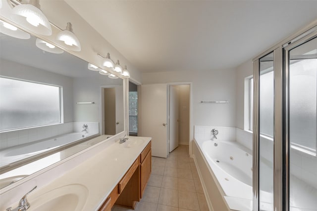 bathroom with a bathing tub, tile patterned floors, and vanity