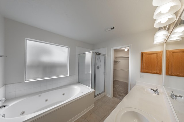 bathroom featuring vanity, tile patterned floors, and separate shower and tub