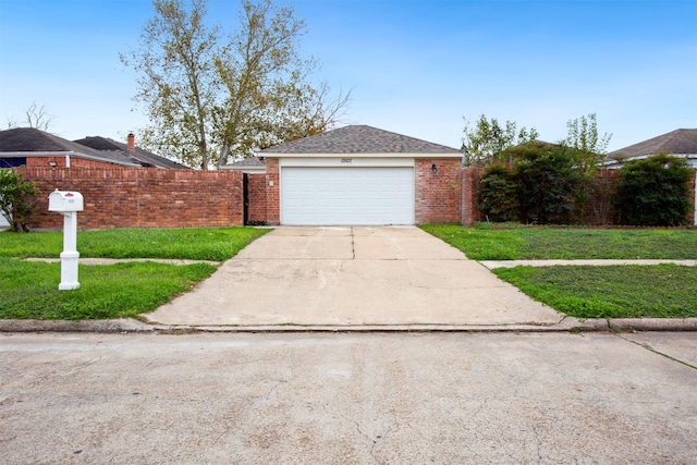 ranch-style home featuring a garage and a front lawn