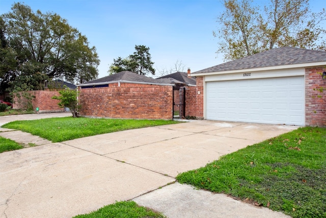 single story home with a front yard and a garage