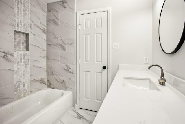 bathroom with tiled shower / bath combo and vanity