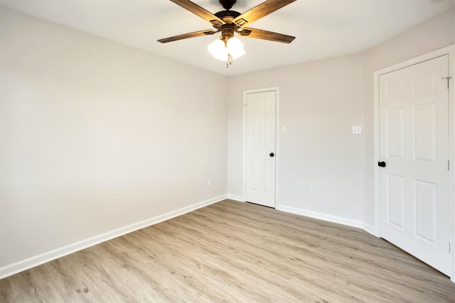 spare room with ceiling fan and light hardwood / wood-style flooring