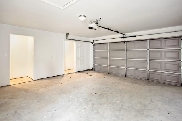 garage featuring a garage door opener