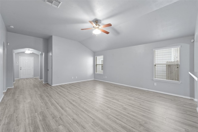 unfurnished room with lofted ceiling, light wood-type flooring, and ceiling fan