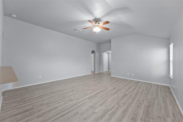 unfurnished living room with ceiling fan, vaulted ceiling, and light hardwood / wood-style flooring