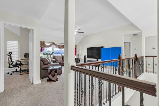 corridor featuring light carpet and lofted ceiling