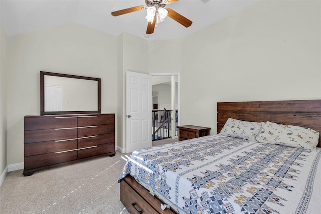 bedroom featuring vaulted ceiling, ceiling fan, and light colored carpet