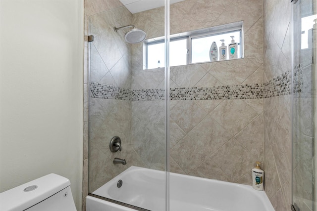 bathroom with toilet and enclosed tub / shower combo